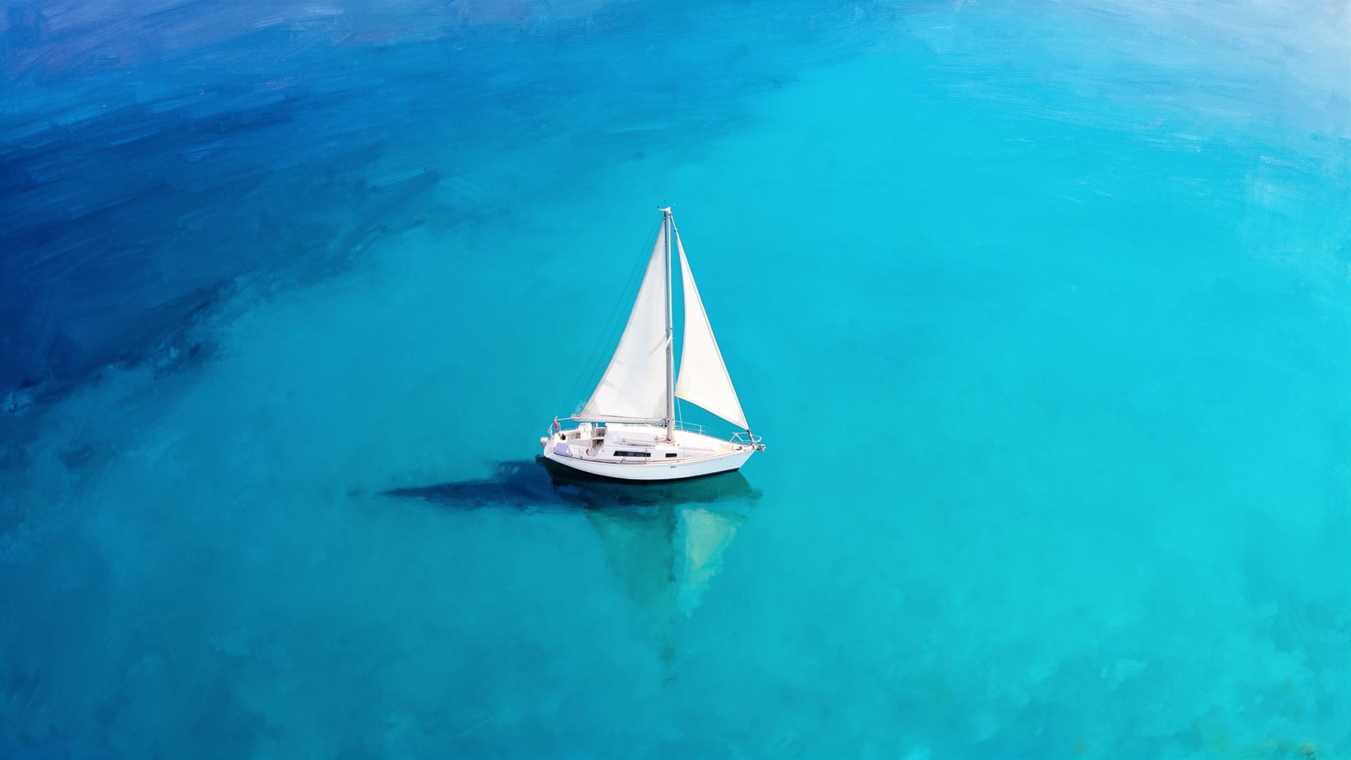 Sailboat on still turquoise sea